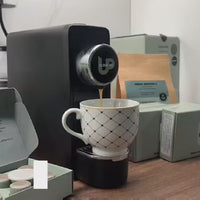 Compact capsule coffee machine